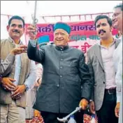  ?? DEEPAK SANSTA/ HT ?? CM Virbhada Singh waving a sword after filing his nomination papers from Arki in Solan district on Friday.