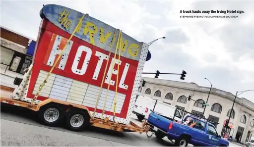  ??  ?? A truck hauls away the Irving Hotel sign. STEPHANIE RYBANDT/ SIX CORNERS ASSOCIATIO­N