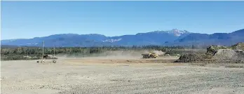  ??  ?? Heavy equipment operators are already hauling, spreading and compacting earth at the main building site for the proposed LNG Canada facility in Kitimat, which would be the closest North American LNG port to Asian markets.