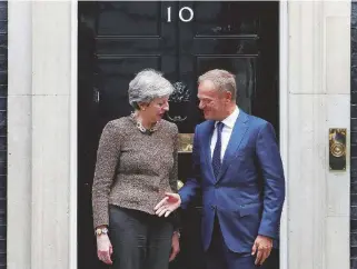  ?? Reuters ?? Perfida albione Theresa May e il presidente del Consiglio europeo Tusk