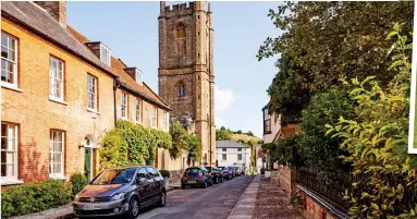  ??  ?? Historic: The charming streets of Dorset’s Cerne Abbas. Inset, the hilltop Cerne Giant