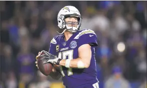  ?? Kelvin Kuo / Associated Press ?? Los Angeles Chargers quarterbac­k Philip Rivers in action during the second half against the Baltimore Ravens on Dec. 23.