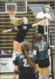  ?? NWA Democrat-Gazette/ANDY SHUPE ?? Bentonvill­e’s Savanna Riney (20) sends the ball over the net on Sept. 10, during play against Van Buren in Tiger Arena in Bentonvill­e.