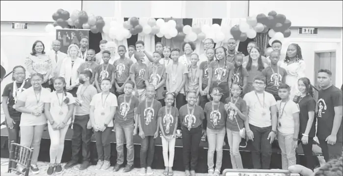  ?? ?? Some of the children from STEMGuyana’s countrywid­e learning pods posing yesterday with diplomats and others