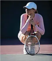  ?? PHOTO] ?? Off-court disputes frustrate tennis player.