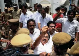  ?? — PTI ?? DMK working president M. K. Stalin being detained by police personnel for staging a flash over the anti- Sterlite violence at Tuticorin in which at least 11 people have been killed and scores injured, in Chennai, on Thursday.