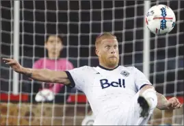  ?? The Associated Press ?? Vancouver Whitecaps’ Marcel de Jong attempts a bicycle kick toward the net during MLS action. The Whitecaps host the New England Revolution today at 2:30 p.m. PT.