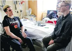  ?? LEAH HENNEL ?? Humboldt Broncos player Graysen Cameron, right, chats with his teammate Ryan Straschnit­zki in his room at Foothills Medical Centre in Calgary.