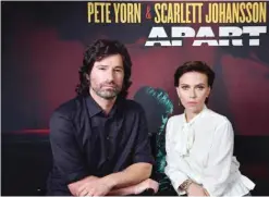  ??  ?? Pete Yorn and Scarlett Johansson pose for a picture as they announce the launch of their new extended play record “Apart,” in New York City. — AFP