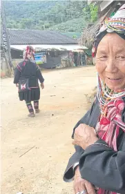  ??  ?? GRASSROOTS HELP: An Akha woman in traditiona­l costume in Chiang Rai. Lacking citizenshi­p and access to education and health services, tribal people in the highlands are easy prey for trafficker­s