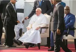  ?? GREGORIO BORGIA/AP ?? Pope Francis sits next to Congolese President Felix Tshisekedi on Tuesday in Kinshasa, Congo. The pontiff’s six-day tour of Africa will include a stop in South Sudan.
