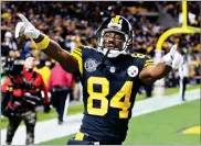  ?? AP PHOTO BY KEITH SRAKOCIC ?? In this Nov. 16 file photo, Pittsburgh Steelers wide receiver Antonio Brown celebrates after scoring a touchdown during a game against the Tennessee Titans in Pittsburgh.