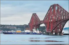  ??  ?? BRIDGING THE GAP: The Ineos Insight gas carrier sails under the Forth Bridge.