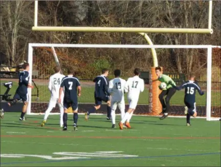  ?? PHOTO PROVIDED ?? Mount Academy’s Everett Button, in blue and wearing No. 4, scores the Eagles’ first goal in the second half of Saturday’s Class D semifinal game in Marlboro, N.Y.