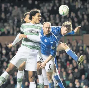  ??  ?? Aerial duel Murray Davidson clears from Celtic’s Virgil Van Dijk