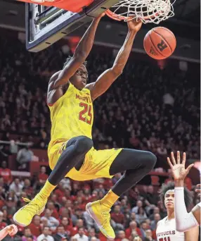  ?? JOHN MINCHILLO/AP ?? Maryland’s Jalen Smith dunks against Rutgers during a game last season. Smith averaged 15.5 points and 10.5 rebounds last season.