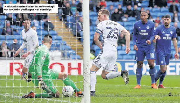  ??  ?? >
Michael Morrison’s shot is somehow kept out by Cardiff goalkeeper Neil Etheridge