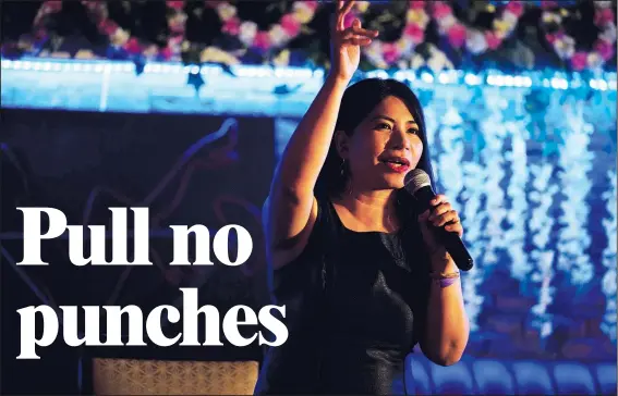  ?? (AP/Jon Gambrell) ?? Filipina comedian Imah Dumagay performs stand-up comedy Aug. 8 during an open-mic night at the Hi Five Restaurant & Lounge in Dubai, United Arab Emirates.