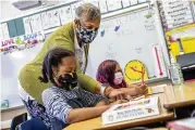  ?? SAN FRANCISCO CHRONICLE VIA AP ?? Joy Harrison instructs her second graders at Carl B. Munck Elementary School, in Oakland, Calif. Oakland is closing seven schools.