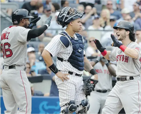  ?? FRANK FRANKLIN II / THE ASSOCIATED PRESS FILES ?? The Boston Red Sox, celebratin­g a home run in a recent game against the New York Yankees, reportedly used an Apple Watch to steal pitching signs during baseball games, including against the Yankees.