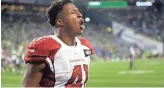  ?? AP ?? Arizona’s Kenyan Drake celebrates after one of his two touchdowns against Seattle on Sunday.