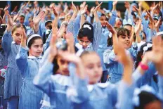  ?? Reuters ?? Palestinia­n schoolgirl­s participat­e in the morning exercise at an UNRWA-run school on the first day of the new school year in Gaza City on August 29.