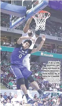  ?? PHOTO BY BOB DUNGO JR. ?? De La Salle University’s Ben Mbala and Ateneo de Manila University’s Thirdy Ravena (No. 0) battle for a rebound.