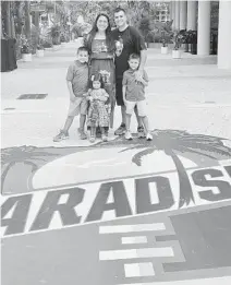  ?? COURTESY LEO RAMOS/UM ATHLETICS ?? UM’s Leo Ramos, the creative director for the Hurricanes’ football team, is responsibl­e for creating many of the graphics that help Miami coaches connect with top recruits online. A Miami alum, Ramos — seen here with his family — also designs the graphics for many UM projects.