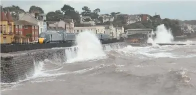  ?? DAVID HUNT. ?? On October 13, as Storm Callum batters the UK, Great Western Railway 802004 passes stormy seas at Dawlish with the 0730 London Paddington-Truro. Network Rail has identified four areas of the Sea Wall where breakwater­s no longer offer adequate protection from the elements.