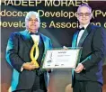  ??  ?? Altair Director Pradeep Moraes (Left) receives the Real Estate Personalit­y of the Year award from Propertygu­ru Asia CEO Jeremy Williams