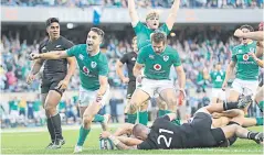  ??  ?? Decider: Conor Murray celebrates Robbie Henshaw’s try which sealed Ireland’s triumph