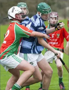  ??  ?? Alfie Eite of St. James’s is challenged by Jack Moore (Kilmore).