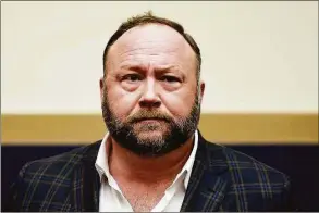  ?? Olivier Douliery / Tribune News Service ?? Four Sandy Hook parents have sued “Infowars” founder Alex Jones, claiming he “transferre­d millions of dollars from his fortune” to shield his assets from them.