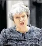  ?? MATT DUNHAM / ASSOCIATED PRESS ?? British Prime Minister Theresa May speaks to the media Wednesday outside her residence in London. She said the European Commission has hardened its Brexit stance.