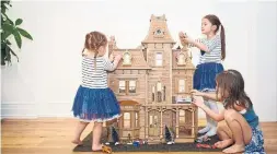  ?? COLE BURSTON TORONTO STAR ?? NOW: Their spacious home provides room to play with the three-storey dollhouse the girls’ grandfathe­r made.