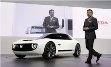  ??  ?? Honda chief Takahiro Hachigo introduces the Urban EV to Tokyo