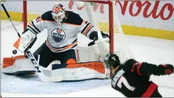  ?? Canadian Press photo ?? Ottawa Senators left wing Brady Tkachuk (7) fires the puck wide of the net as Edmonton Oilers goaltender Mike Smith looks on during first period NHL action Monday in Ottawa.