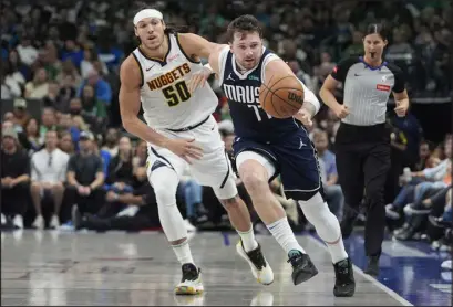  ?? LM OTERO — THE ASSOCIATED PRESS ?? Dallas guard Luka Doncic ( 77) has put together an MVP- caliber campaign for a red- hot Mavericks team that will play the L. A. Clippers in the first round.