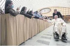  ?? AFP ?? A Vatican press office photo shows Pope Francis meeting pilgrims at an audience in the Paul VI hall at the Vatican on Thursday.