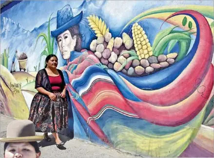  ?? AFP ?? Alwa, the first Aymara indigenous woman rapper in Bolivia, poses in front of a mural in El Alto.