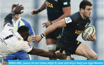  ?? — AFP ?? BUENOS AIRES: Jaguares full back Emiliano Boffelli (R) eludes South Africa’s Sharks prop Tendai Mtawarira (L) during their Super Rugby match at Jose Amalfitani stadium in Buenos Aires, on Friday.