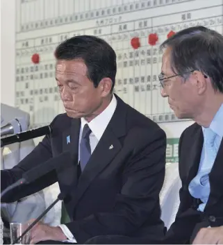  ?? Yomiuri Shimbun file photo ?? Then Prime Minister Taro Aso and other LDP leader looks grim at a press conference at Liberal Democratic Party headquarte­rs in Tokyo on Aug. 30, 2009, the day the LDP last lost a general election.