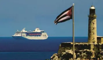  ?? YAMIL LAGE/GETTY ?? A Royal Caribbean cruise sails into the Havana Harbor in 2019. The cruise line industry was not included in the Biden administra­tion’s revised Cuba policy that included an easing of travel restrictio­ns between the U.S. and the Communist island.