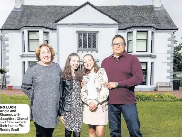  ??  ?? NO LUCK Angie and Shamus with daughters Sinead and Elise outside their home. Pic: Roddy Scott