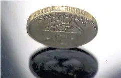  ?? REUTERS ?? An Australian dollar coin is seen in a photo illustrati­on.