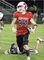  ?? Daniel Bell ?? Sonoravill­e running back Zach Lyles breaks loose on a run against Chattooga in this file photo. Lyles scored four touchdowns on the night.