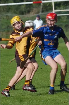  ??  ?? Robert Quinn (Askamore) and Craig Grannell (Ballinastr­agh Gaels) battle it out for possession.