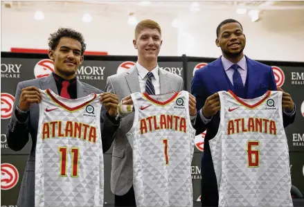  ?? JOHN BAZEMORE / ASSOCIATED PRESS ?? The Hawks’ first-round draft picks (from left) Trae Young, Kevin Huerter and Omari Spellman all were accurate 3-point shooters in college despite taking a lot of attempts. They were drafted by Travis Schlenk, who once worked for Golden State.