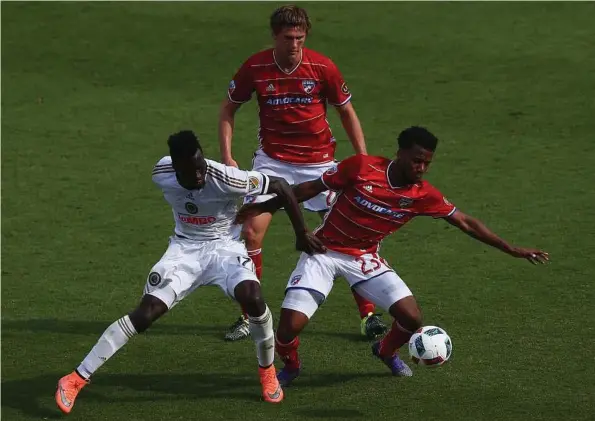  ?? Ronald Martinez / Getty Images ?? Kellyn Acosta, No. 23 of FC Dallas, dribbles the ball against C.J. Sapong of Philadelph­ia Union in the second half at Toyota Stadium in Frisco. FC Dallas has picked right up where it left off last year with strong play. They play the Dynamo on Saturday.