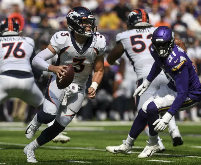  ?? Aaron Ontiveroz, The Denver Post ?? Broncos quarterbac­k Drew Lock scrambles as Stephen Weatherly of the Minnesota Vikings pressures him during a preseason game. The Broncos announced this week that Teddy Bridgewate­r, not Lock, will start Week 1 vs. the New York Giants.